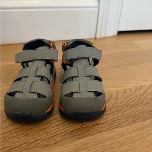 NWOT. Never worn. See Kai Run Gray and Orange Sandals with Velcro Straps.